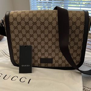 Brand new Gucci Canvas Messenger Bag. Never used. Measurements: 12x9x3.5.